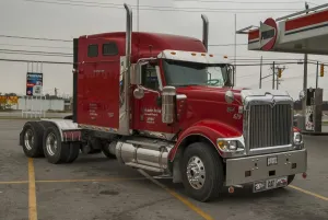 Red International eagle 6 x4 semi at a service station on the outskirts of the Red International eagle 6 x4 semi at a service station on the outskirts of the