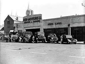 Truro Collection: British Army service vehicles outside H. T. P. Motors Ltd. Back Quay, Truro, Cornwall. Around 1944
