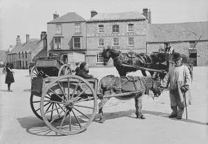 A donkey and cart in Market Square, St Just in Penwith, Cornwall. Early 1900s A donkey and cart in Market Square, St Just in Penwith, Cornwall. Early 1900s
