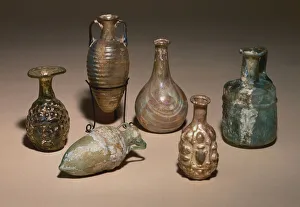 A group of delicate Roman blown and mould blown glass cosmetics flasks A group of delicate Roman blown and mould blown glass cosmetics flasks