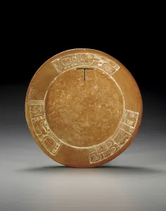 A Mayan carved plate, with a T boldly cut-out A Mayan carved plate, with a T boldly cut-out