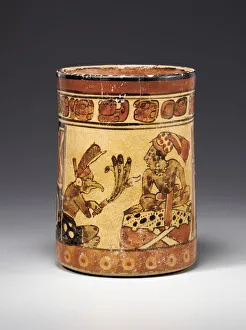 A Mayan polychrome vessel depicting a crosslegged lord seated on a dais covered with A Mayan polychrome vessel depicting a crosslegged lord seated on a dais covered with