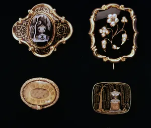 Mourning jewels, mid-Victorian brooches set in gold Mourning jewels, mid-Victorian brooches set in gold
