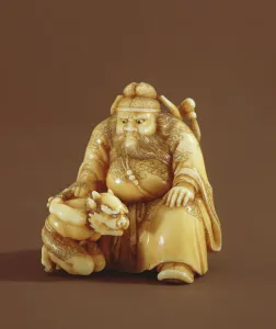 Netsuke in the form of a demon queller and a small demon, Meiji Period (1868-1912) Netsuke in the form of a demon queller and a small demon, Meiji Period (1868-1912)