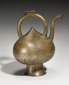 A Safavid brass ewer, Iran, 17th century (brass) A Safavid brass ewer, Iran, 17th century (brass)