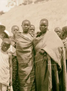 Uganda Hoima Fort Portal Two young women leading family Uganda Hoima Fort Portal Two young women leading family