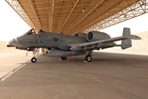 An A-10 Thunderbolt II awaits a mission at an airbase An A-10 Thunderbolt II awaits a mission at an airbase
