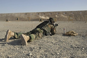 An Afghan Commando engages training targets on the firing range An Afghan Commando engages training targets on the firing range