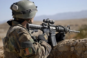 An Afghan Commando scans the horizon for enemy activity An Afghan Commando scans the horizon for enemy activity