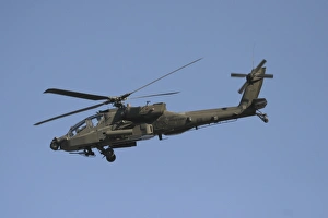 AH-64 Apache in flight over the Baghdad Hotel in central Baghdad, Iraq AH-64 Apache in flight over the Baghdad Hotel in central Baghdad, Iraq