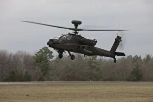 Ah 64 Collection: An AH-64 Apache helicopter in midair, Conroe, Texas