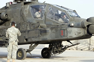 An AH-64 Apache prepares to leave its pad for a mission An AH-64 Apache prepares to leave its pad for a mission