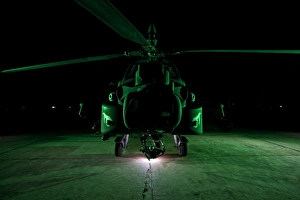 Military Helicopter Prints: An AH-64D Apache helicopter at night
