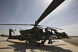 An AH-64D Apache helicopter parked at Camp Speicher, Iraq An AH-64D Apache helicopter parked at Camp Speicher, Iraq