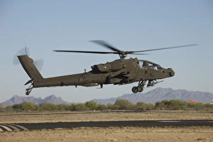 AH-64D Apache Longbow lifts off on a mission AH-64D Apache Longbow lifts off on a mission