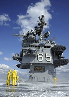 Air department Sailors test the sprinkler system on the flight deck of the USS Enterprise Air department Sailors test the sprinkler system on the flight deck of the USS Enterprise