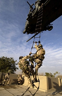 Air Force pararescuemen are extracted by an HH-60G Pave Hawk helicopter Air Force pararescuemen are extracted by an HH-60G Pave Hawk helicopter