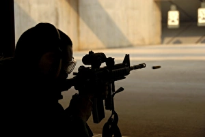 An Airman tests his skills at the shooting range An Airman tests his skills at the shooting range
