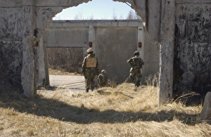 Airmen find a designated location during a land navigation exercise Airmen find a designated location during a land navigation exercise