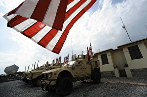 American flags are displayed on tactical vehicles in remembrance of 9/11 American flags are displayed on tactical vehicles in remembrance of 9/11