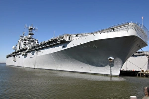 The amphibious assault ship USS Nassau sits moored in port The amphibious assault ship USS Nassau sits moored in port