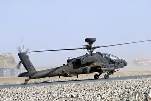 An Apache helicopter prepares for takeoff at Camp Bastion, Afghanistan An Apache helicopter prepares for takeoff at Camp Bastion, Afghanistan