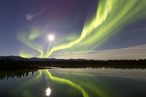 Aurora borealis and Full Moon over the Yukon River, Canada Aurora borealis and Full Moon over the Yukon River, Canada