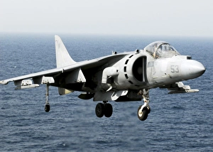 An AV-8B Harrier hovers over the flight deck of USS peleliu An AV-8B Harrier hovers over the flight deck of USS peleliu