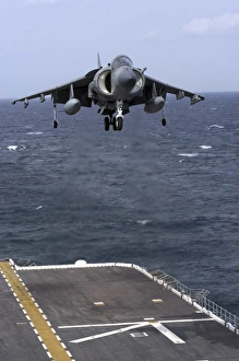 An AV-8B Harrier II prepares to land on the flight deck of USS Nassau An AV-8B Harrier II prepares to land on the flight deck of USS Nassau