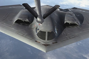 A B-2 Spirit bomber prepares to refuel from a KC-135 Stratotanker A B-2 Spirit bomber prepares to refuel from a KC-135 Stratotanker