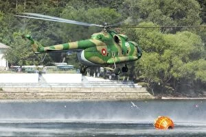 Bulgaria Collection: Bulgarian Air Force Mi-17 taking water with Bambi Bucket