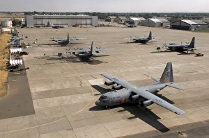 C-130 Hercules aircraft stationed at an airbase C-130 Hercules aircraft stationed at an airbase