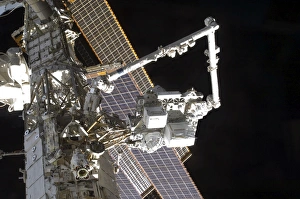 The Canadarm2 mates the Express Logistics Carrier to the Outboard Payload Attachment The Canadarm2 mates the Express Logistics Carrier to the Outboard Payload Attachment