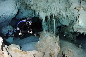 Cavern diver in Dos Ojos cenote system, Yucatan Peninsula Mexico Cavern diver in Dos Ojos cenote system, Yucatan Peninsula Mexico