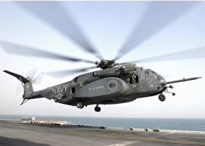 a CH-53 Sea Stallion helicopter leaves the flight deck of USS Kearsarge a CH-53 Sea Stallion helicopter leaves the flight deck of USS Kearsarge