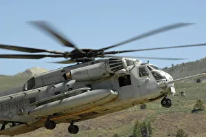 A CH-53 Super Stallion helicopter lands at the Mountain Warfare Training Center in A CH-53 Super Stallion helicopter lands at the Mountain Warfare Training Center in