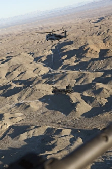 A CH-53E Super Stallion transports a CH-47 Chinook over Afghanistan A CH-53E Super Stallion transports a CH-47 Chinook over Afghanistan