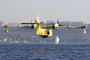 A CL-415 Italian Fire Hunter flying above a lake in Italy A CL-415 Italian Fire Hunter flying above a lake in Italy