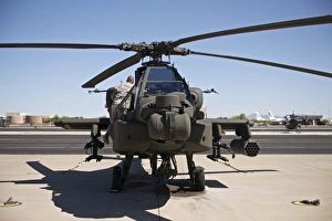 Crew chief working on an AH-64D Apache Longbow Crew chief working on an AH-64D Apache Longbow