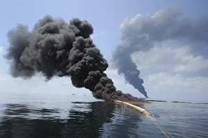 Dark clouds of smoke and fire emerge as oil burns during a controlled fire in the Dark clouds of smoke and fire emerge as oil burns during a controlled fire in the