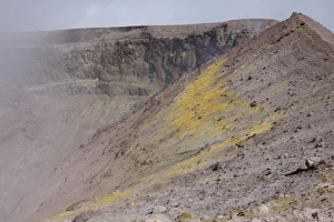 Degassing North crater with fumarolic sulphur deposits. Mount Etna volcano, Sicily, Italy Degassing North crater with fumarolic sulphur deposits. Mount Etna volcano, Sicily, Italy