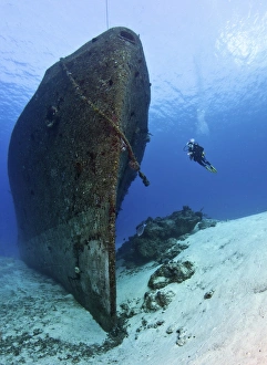 Diver exploring the Felipe Xicotencatl shipwreck in Cozumel, Mexico Diver exploring the Felipe Xicotencatl shipwreck in Cozumel, Mexico