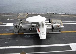 An E-2C Hawkeye makes an arrested landing aboard USS George Washington An E-2C Hawkeye makes an arrested landing aboard USS George Washington