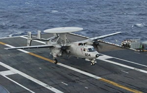 An E-2C Hawkeye is recovered during flight deck operations aboard USS Theodore Roosevelt An E-2C Hawkeye is recovered during flight deck operations aboard USS Theodore Roosevelt