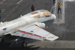 An EA-6B Prowler is guided onto a catapult aboard USS Harry S. Truman An EA-6B Prowler is guided onto a catapult aboard USS Harry S. Truman