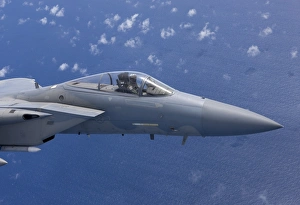 An F-15 Eagle flies over the Pacific Ocean during a training mission An F-15 Eagle flies over the Pacific Ocean during a training mission