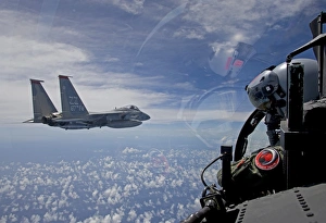 An F-15 Eagle pilot flies in formation with his wingman An F-15 Eagle pilot flies in formation with his wingman