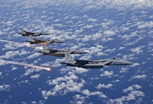 Four F-15 Eagles fly in formation over the Pacific Ocean Four F-15 Eagles fly in formation over the Pacific Ocean