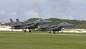 Two F-15 Eagles take off in formation from Kadena Air Base, Japan Two F-15 Eagles take off in formation from Kadena Air Base, Japan