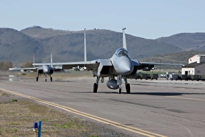 Two F-15 Eagles taxi out to take off on a training mission Two F-15 Eagles taxi out to take off on a training mission